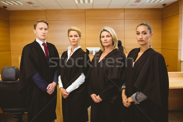 Four serious judges standing while wearing robes  Stock photo © wavebreak_media