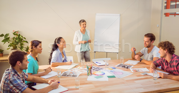 Femme d'affaires présentation collègues jeunes portable [[stock_photo]] © wavebreak_media