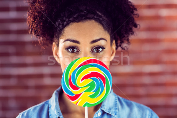 Portrait belle femme géant lollipop brique Photo stock © wavebreak_media