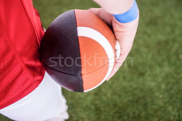 American football player holding the ball  Stock photo © wavebreak_media