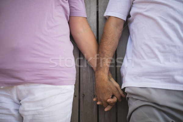Középső rész idős pár kéz a kézben veranda férfi ital Stock fotó © wavebreak_media