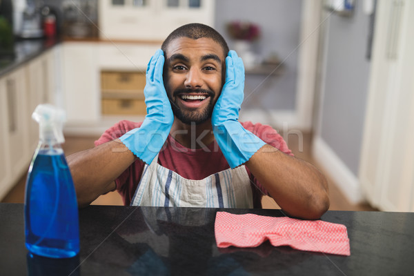 Portrait of surprised man by marble counter in kitchen Stock photo © wavebreak_media