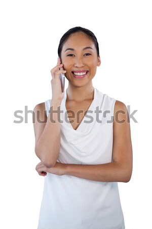 Portrait of smiling businesswoman using mobile phone Stock photo © wavebreak_media