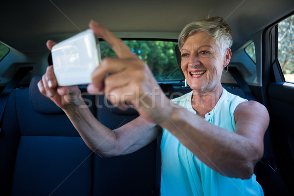 Senior woman taking selfie on mobile phone Stock photo © wavebreak_media