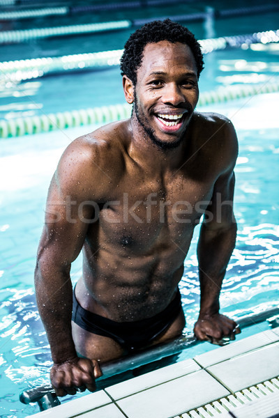 Smiling fit man in the swimming pool Stock photo © wavebreak_media
