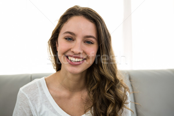 Gülümseyen kamera kanepe kadın ev portre Stok fotoğraf © wavebreak_media
