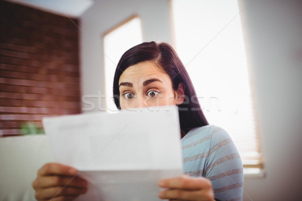 Femme lecture lettre jeune femme maison [[stock_photo]] © wavebreak_media