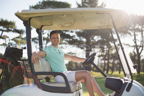 Portret smart człowiek posiedzenia golf zabawy Zdjęcia stock © wavebreak_media