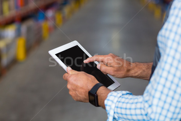 Mid section of warehouse worker using digital tablet Stock photo © wavebreak_media