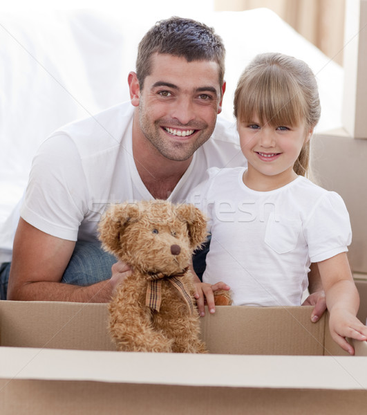 Father and daughter with a teddy bear moving home Stock photo © wavebreak_media