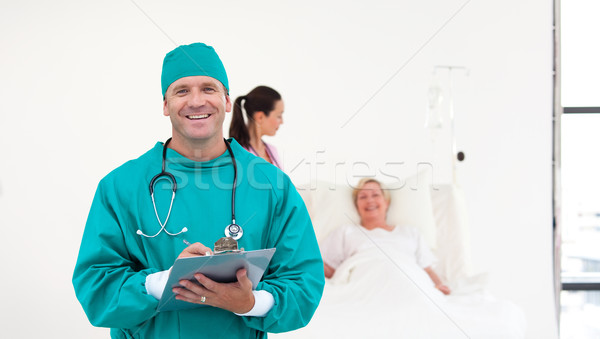 Stock photo: Doctors examining a woman patient