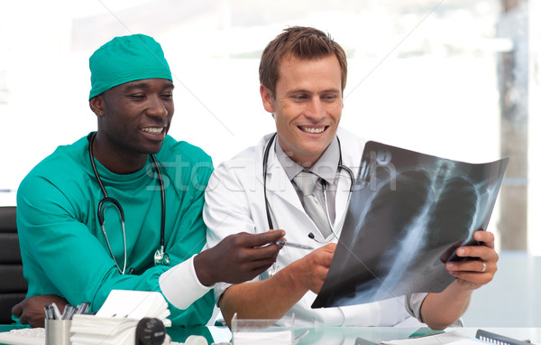 Stock photo: Two doctors examining an x-ray