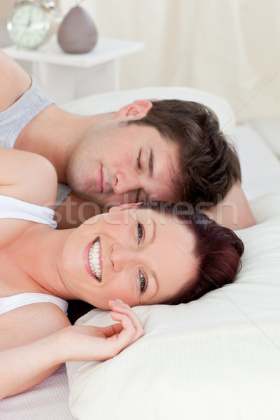 Mosolyog pár ágy otthon kezek boldog Stock fotó © wavebreak_media
