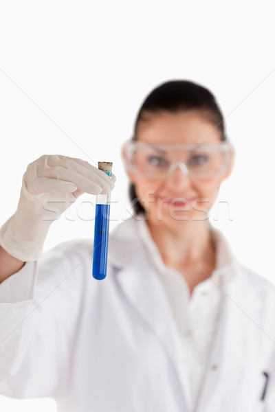 Dark-haired woman conducting an experiment in a lab Stock photo © wavebreak_media