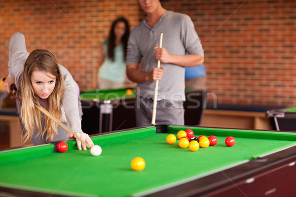 Friends playing snooker in a student home Stock photo © wavebreak_media