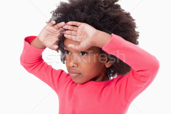 Girl with her hands on her forehead against a white background Stock photo © wavebreak_media