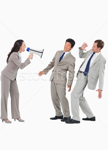 Saleswoman with megaphone yelling at colleagues against a white background Stock photo © wavebreak_media