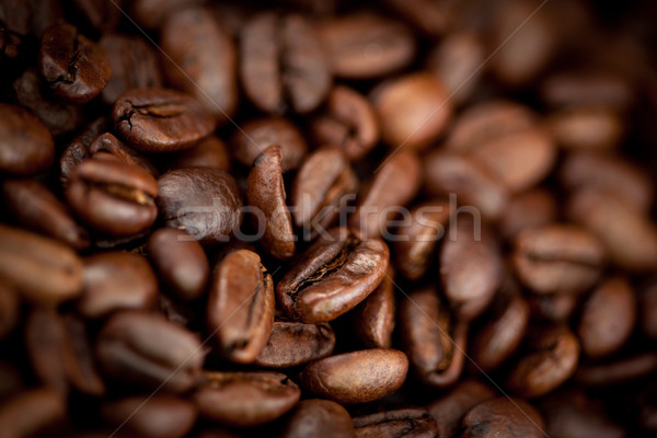 Close up of dark blurred coffee seeds laid out together Stock photo © wavebreak_media