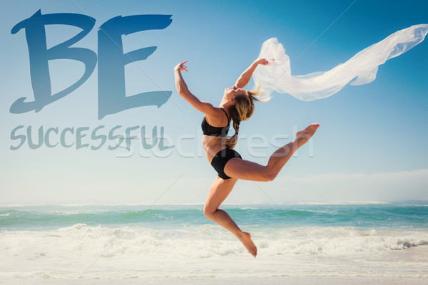 Composite image of fit blonde jumping gracefully with scarf on t Stock photo © wavebreak_media