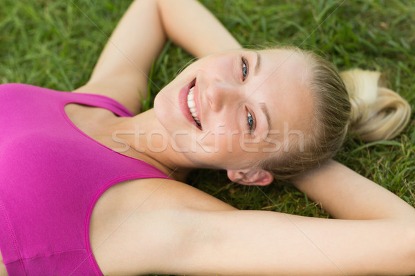 Stock photo: Relaxed beautiful woman lying on grass in park