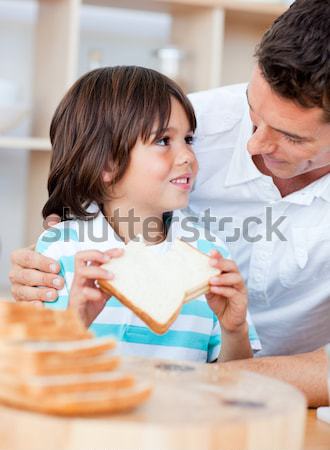 Pediatric dentist showing little girl teeth model Stock photo © wavebreak_media