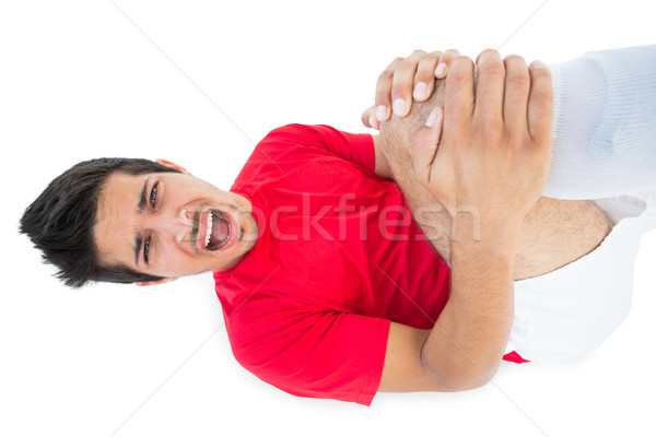 Soccer player lying down and shouting in pain Stock photo © wavebreak_media
