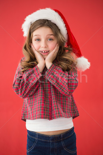 Festive little girl smiling at camera Stock photo © wavebreak_media
