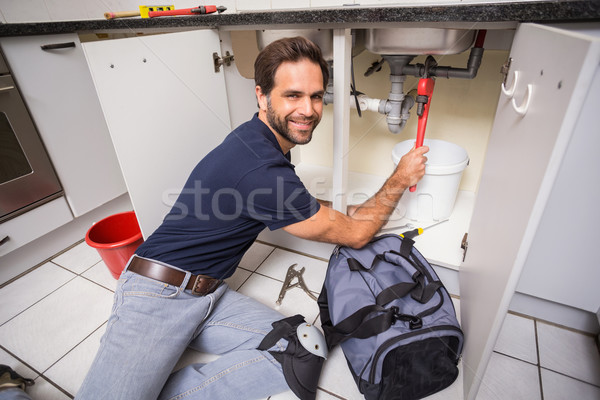 Plumber fixing under the sink Stock photo © wavebreak_media