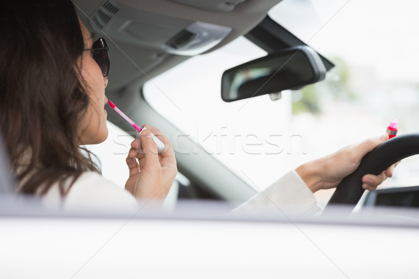 Kadın güneş gözlüğü ayna dudak parlatıcısı araba Stok fotoğraf © wavebreak_media