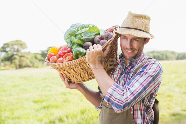 Farmer carrying basket of veg Stock photo © wavebreak_media