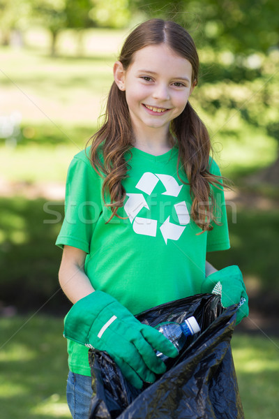 Happy little girl collecting rubbish  Stock photo © wavebreak_media