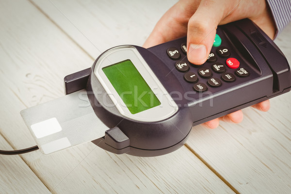 Man entering his pin on terminal Stock photo © wavebreak_media