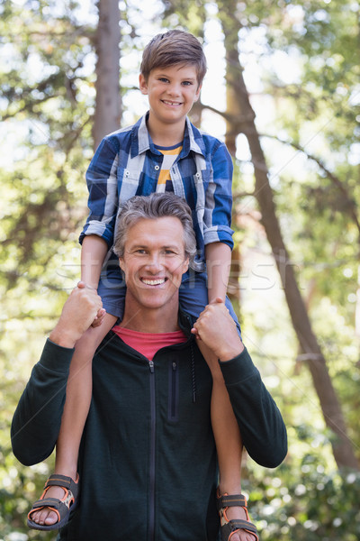 Happy father piggybacking son in forest Stock photo © wavebreak_media