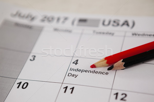 Colored pencil with fourth of july calendar Stock photo © wavebreak_media