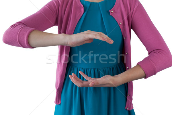 Teenage girl pretending to be hold invisible object  Stock photo © wavebreak_media