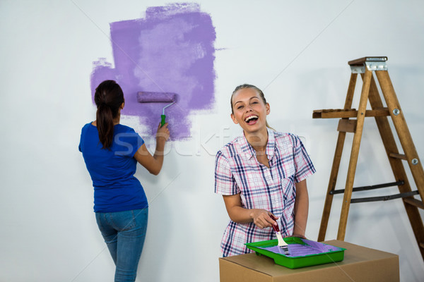 Friends painting a wall Stock photo © wavebreak_media