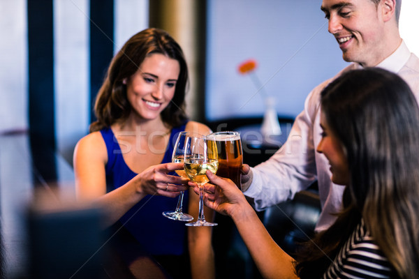 Friends toasting together Stock photo © wavebreak_media