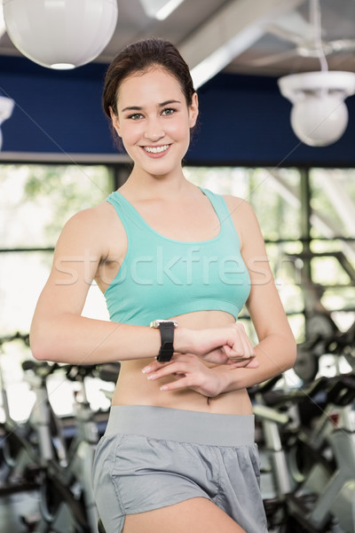 Stock photo: Woman using smart watch