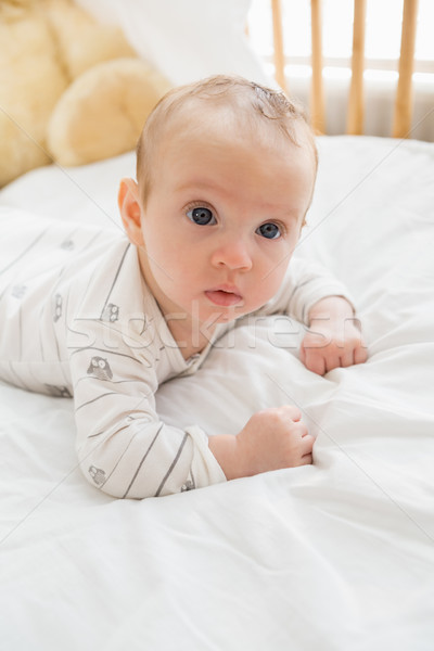 Baby lying on baby bed Stock photo © wavebreak_media