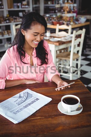 Smiling waitress showing chalkboard with open sign Stock photo © wavebreak_media