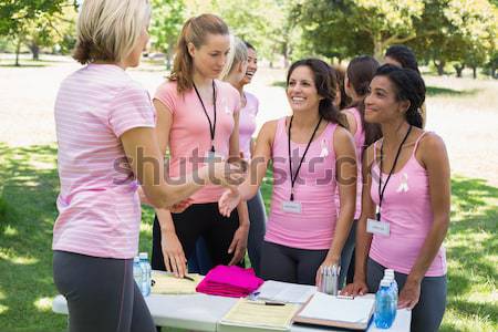 Mujeres manos cáncer de mama conciencia feliz Foto stock © wavebreak_media
