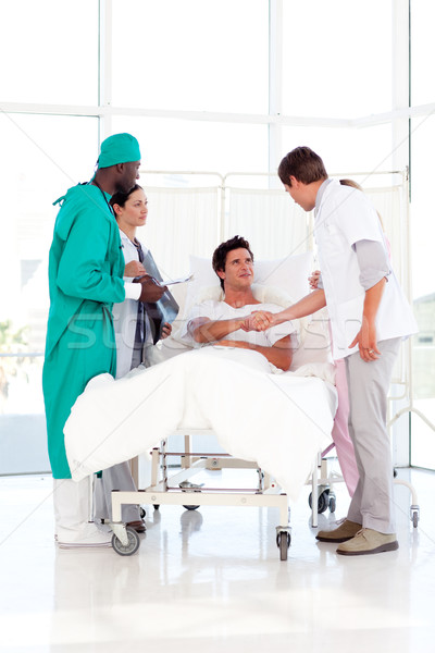 Stock photo: Medical team attending to a patient