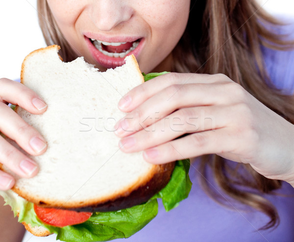 Primer plano mujer comer sándwich aislado blanco Foto stock © wavebreak_media