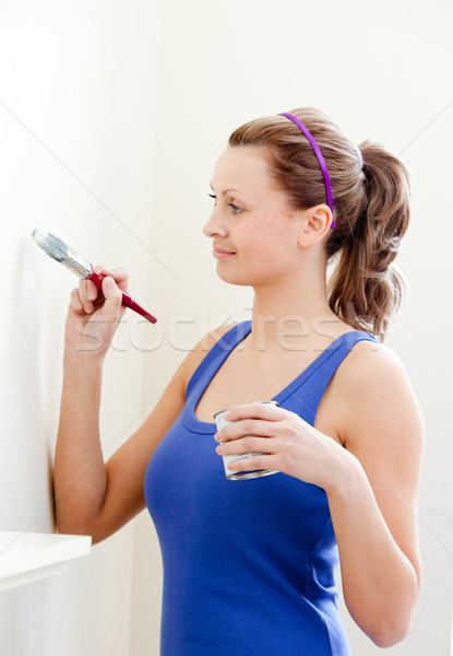 Beautiful woman is decorating a room  Stock photo © wavebreak_media