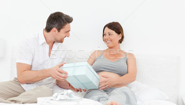 Femme offrant cadeau femme maison sourire [[stock_photo]] © wavebreak_media