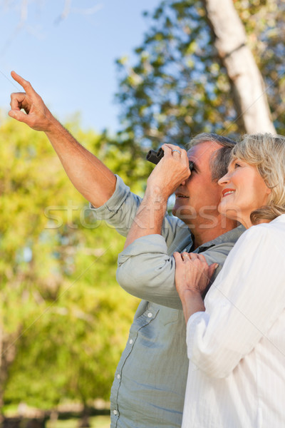 Couple looking at the sky with their binoculars Stock photo © wavebreak_media