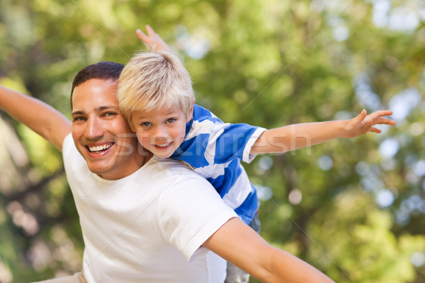 Son playing with his father in the park in a park Stock photo © wavebreak_media