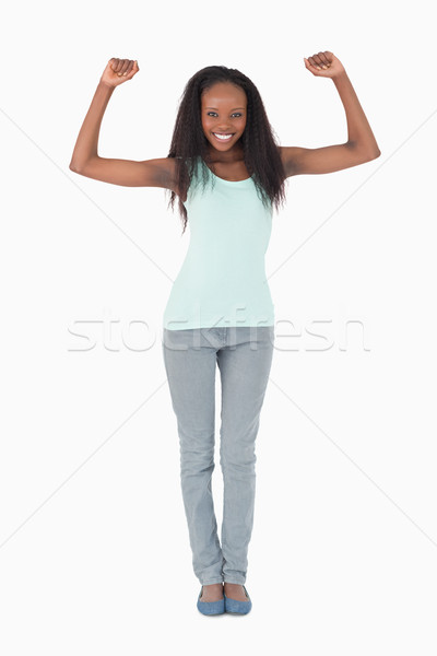 Smiling woman stretching on white background Stock photo © wavebreak_media