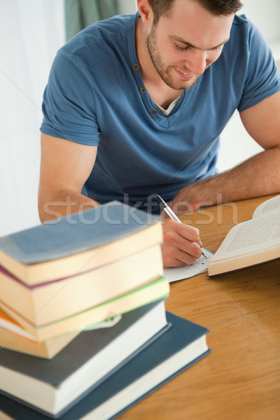 Lächelnd männlich Studenten Buch Bericht Papier Stock foto © wavebreak_media