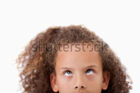Close up of a playful girl looking above her against a white background Stock photo © wavebreak_media